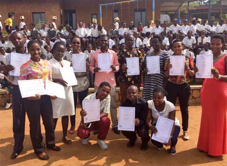Group photo of class with certificates